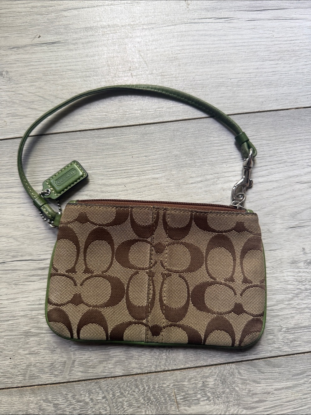 COACH BROWN SIGNATURE WRISLET WITH GREEN TRIM